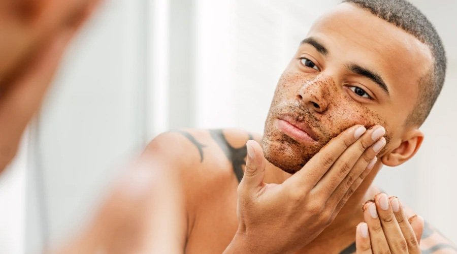 exfoliating the face to remove dead skin cells